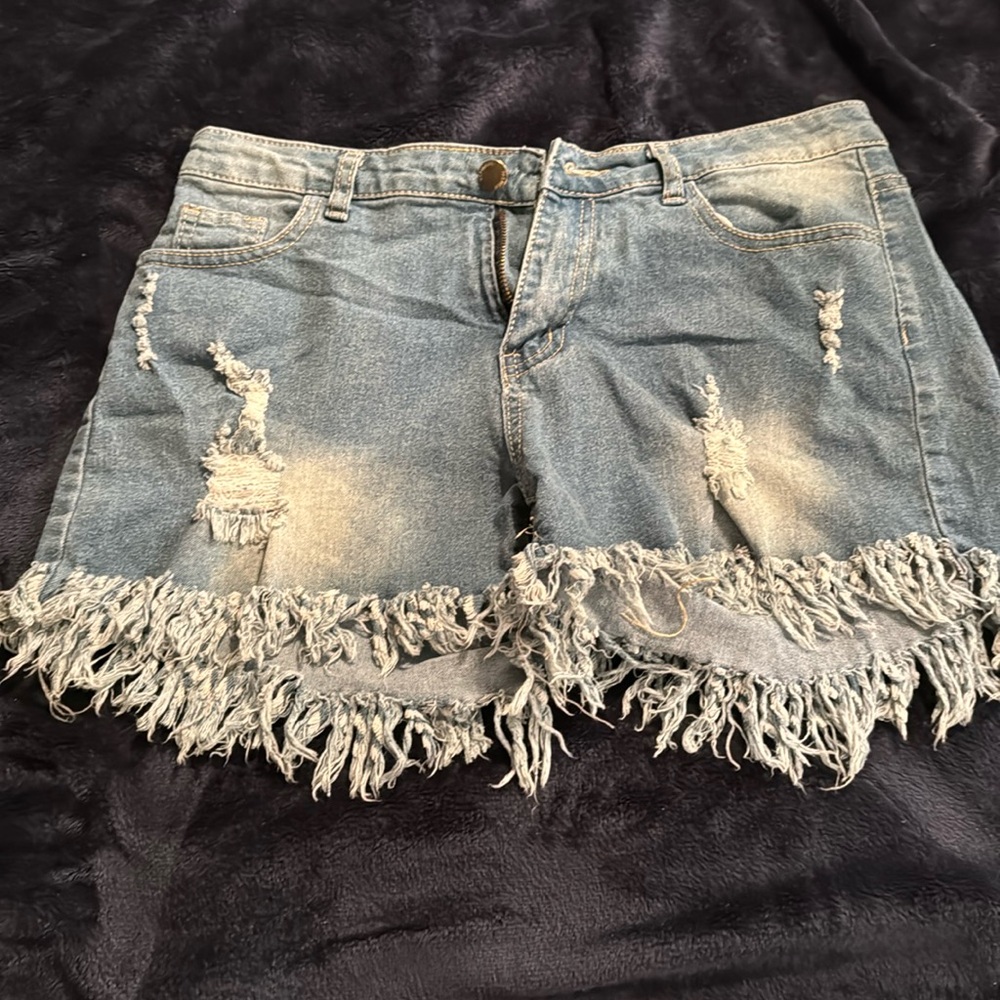 Size large brand new jeans shredded shorts.